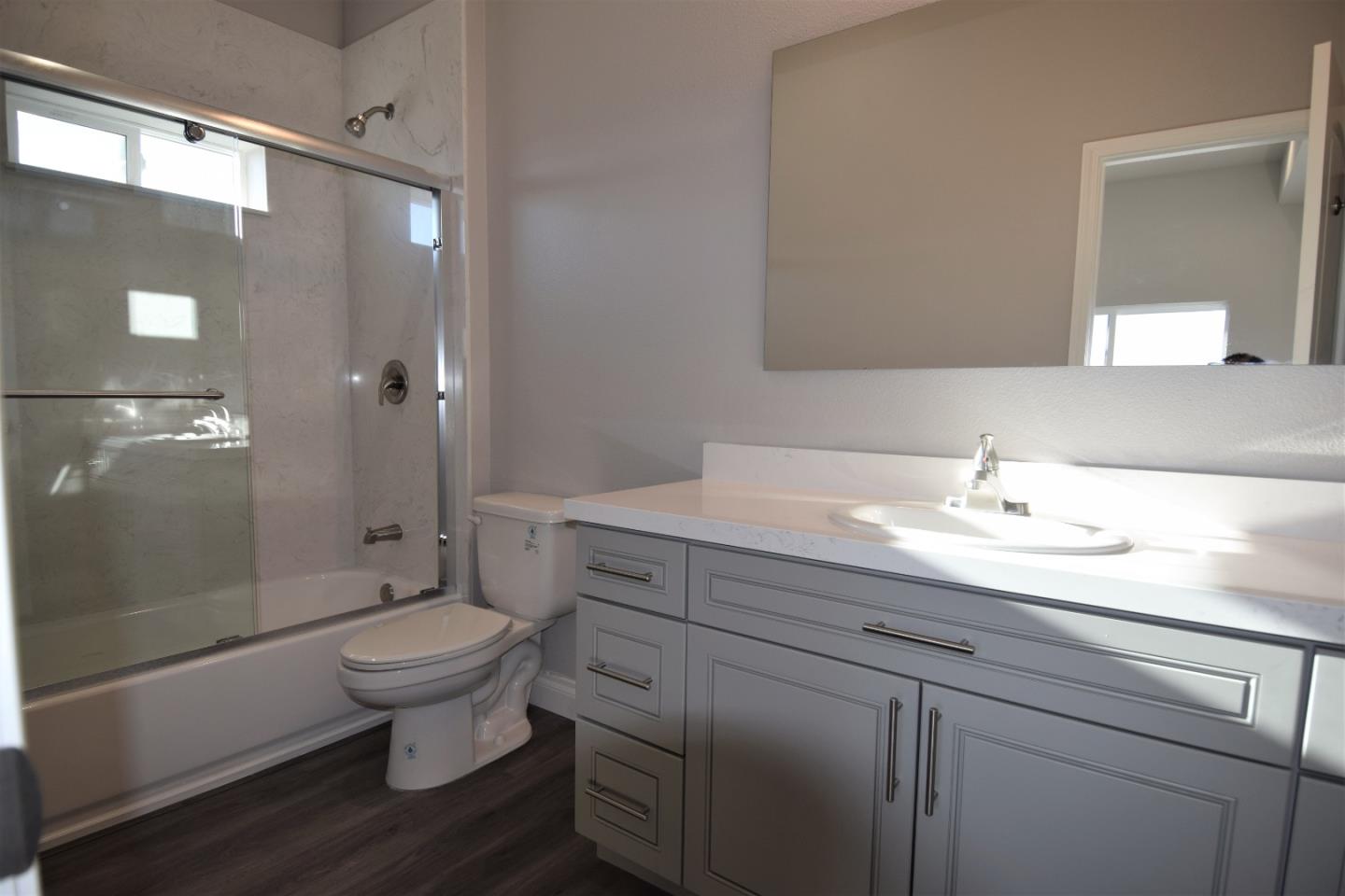 93 South 2nd Street Rio Vista, CA 94571 - Photo 12 of 25 a bathroom with a sink toilet a mirror and shower