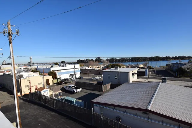 a view of a balcony with wooden floor