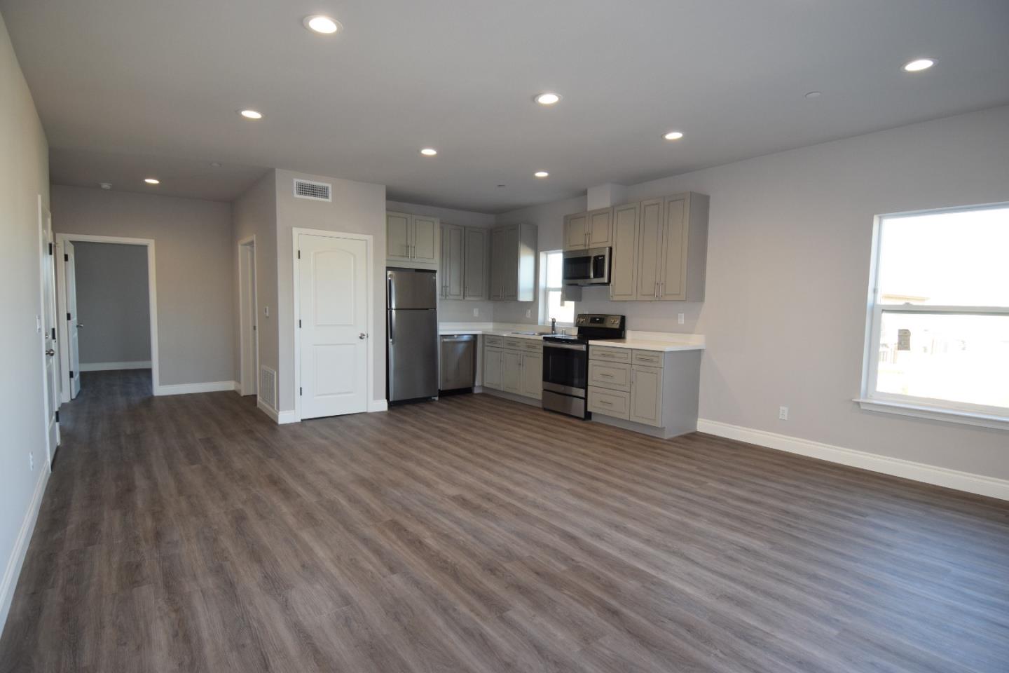 93 South 2nd Street Rio Vista, CA 94571 - Photo 19 of 25 a kitchen with stainless steel appliances a refrigerator and wooden floor