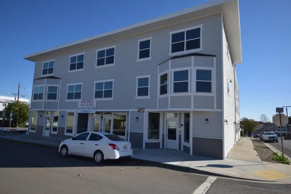 a front view of a building with street view