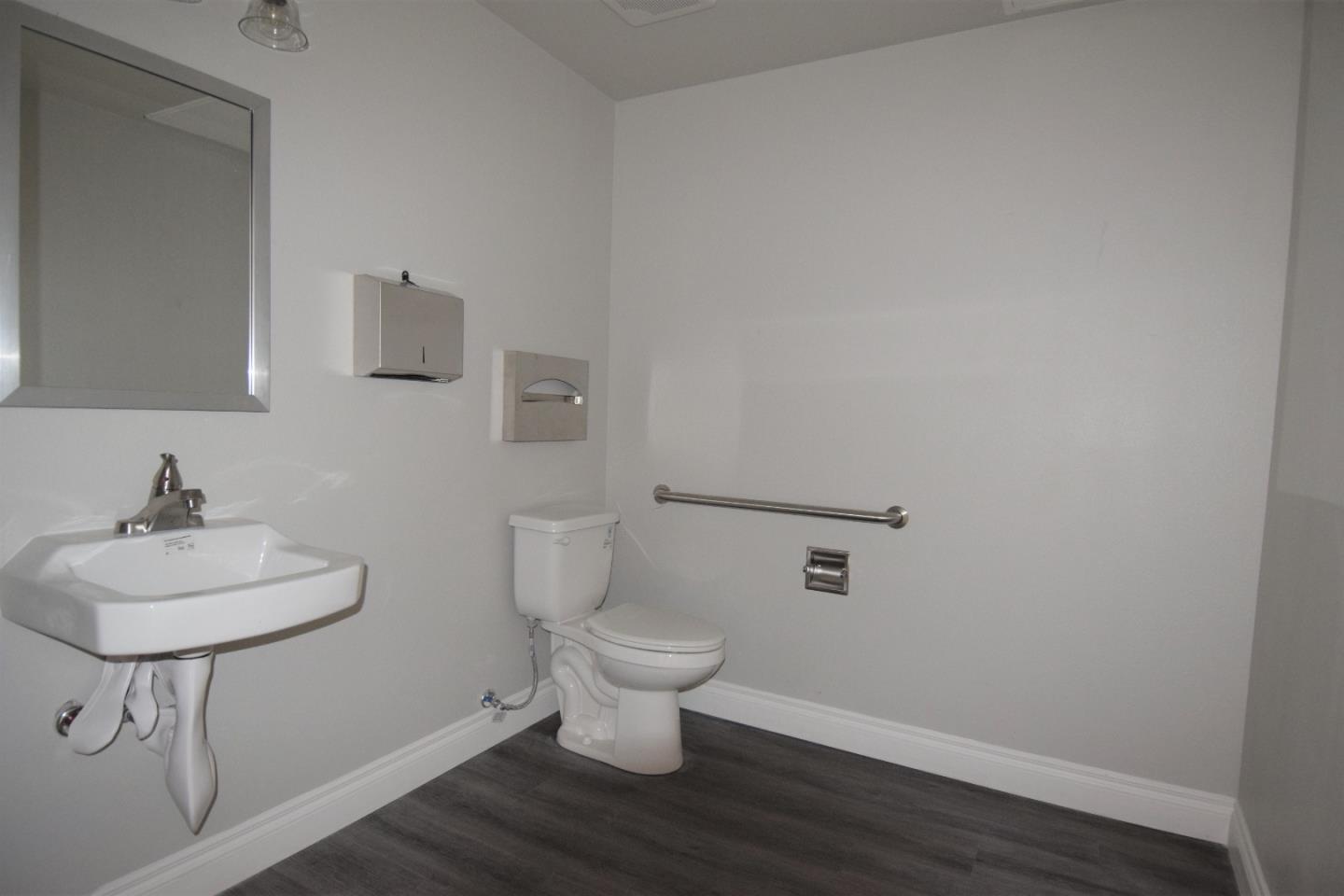 93 South 2nd Street Rio Vista, CA 94571 - Photo 24 of 25 a bathroom with a sink a toilet and a mirror