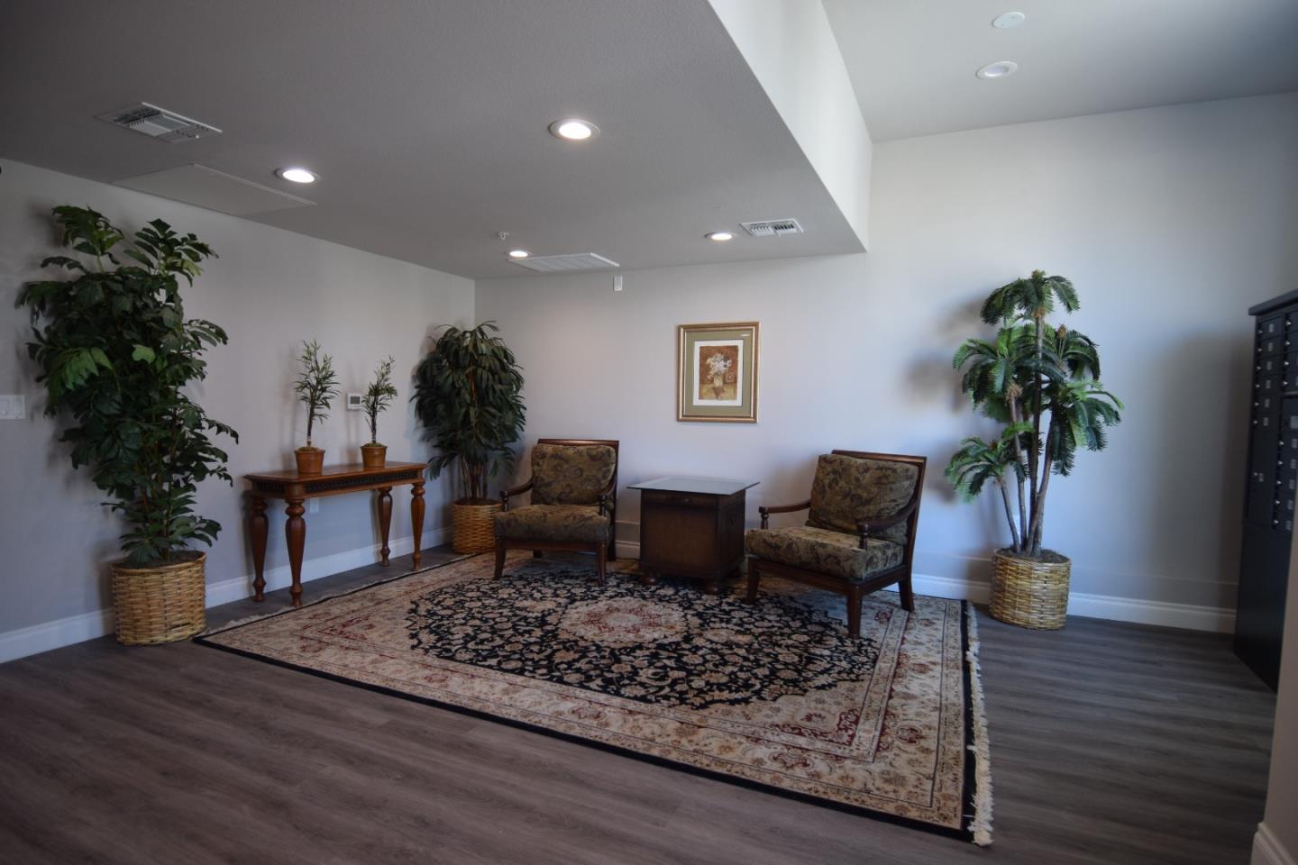 93 South 2nd Street Rio Vista, CA 94571 - Photo 4 of 25 a living room with furniture and a potted plant