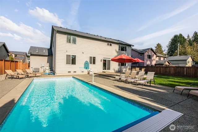 swimming pool with outdoor seating
