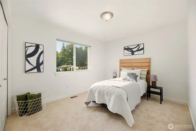 a bedroom with a bed and window