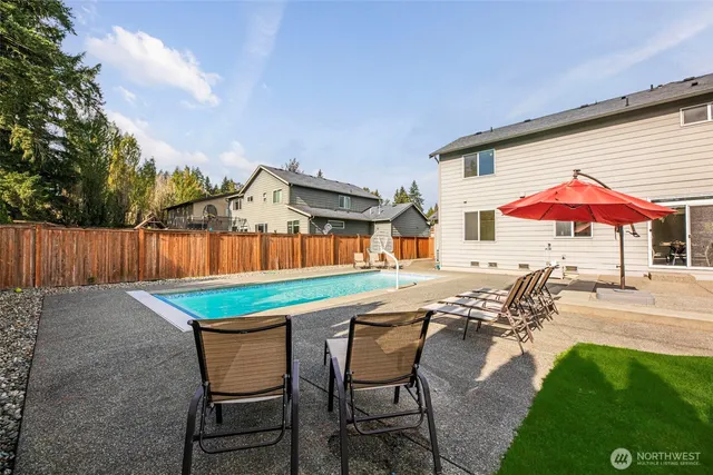 an outdoor space with furniture and umbrella