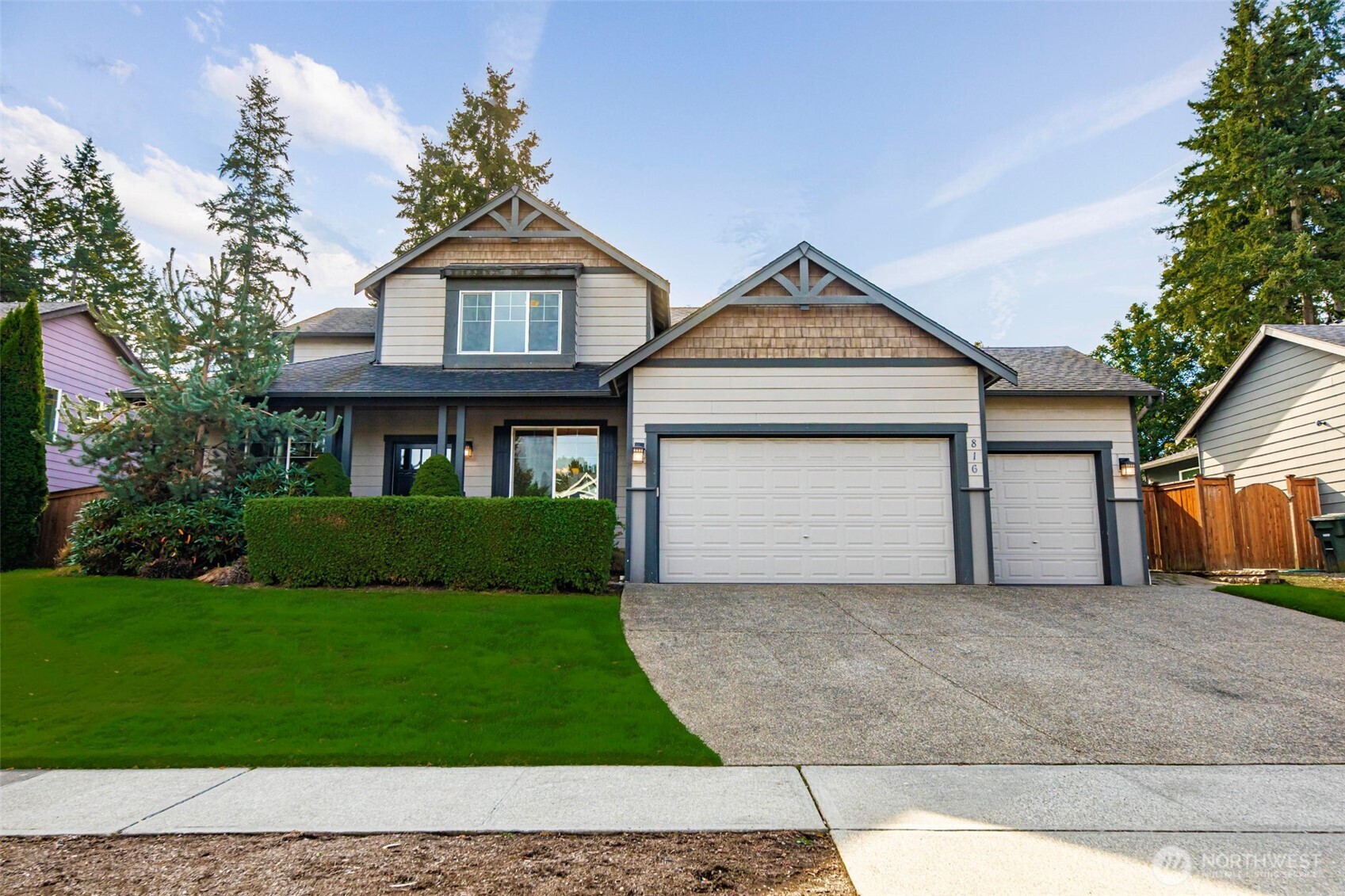 816 218th Street Southeast Bothell, WA 98021 - Photo 32 of 34 a front view of a house with a yard and garage