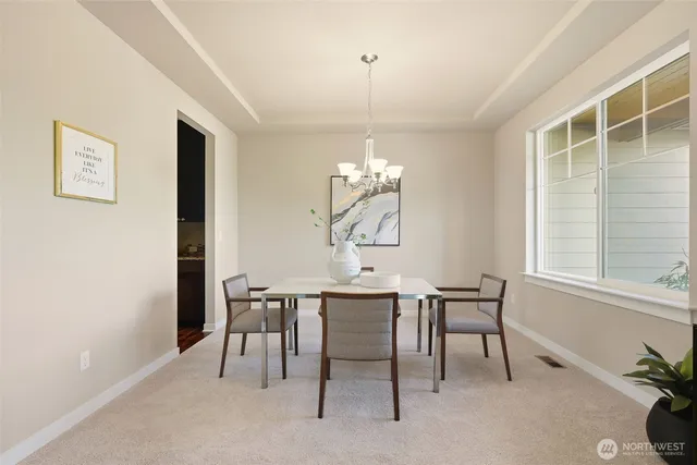 a dining room with wooden floor and breakfast area