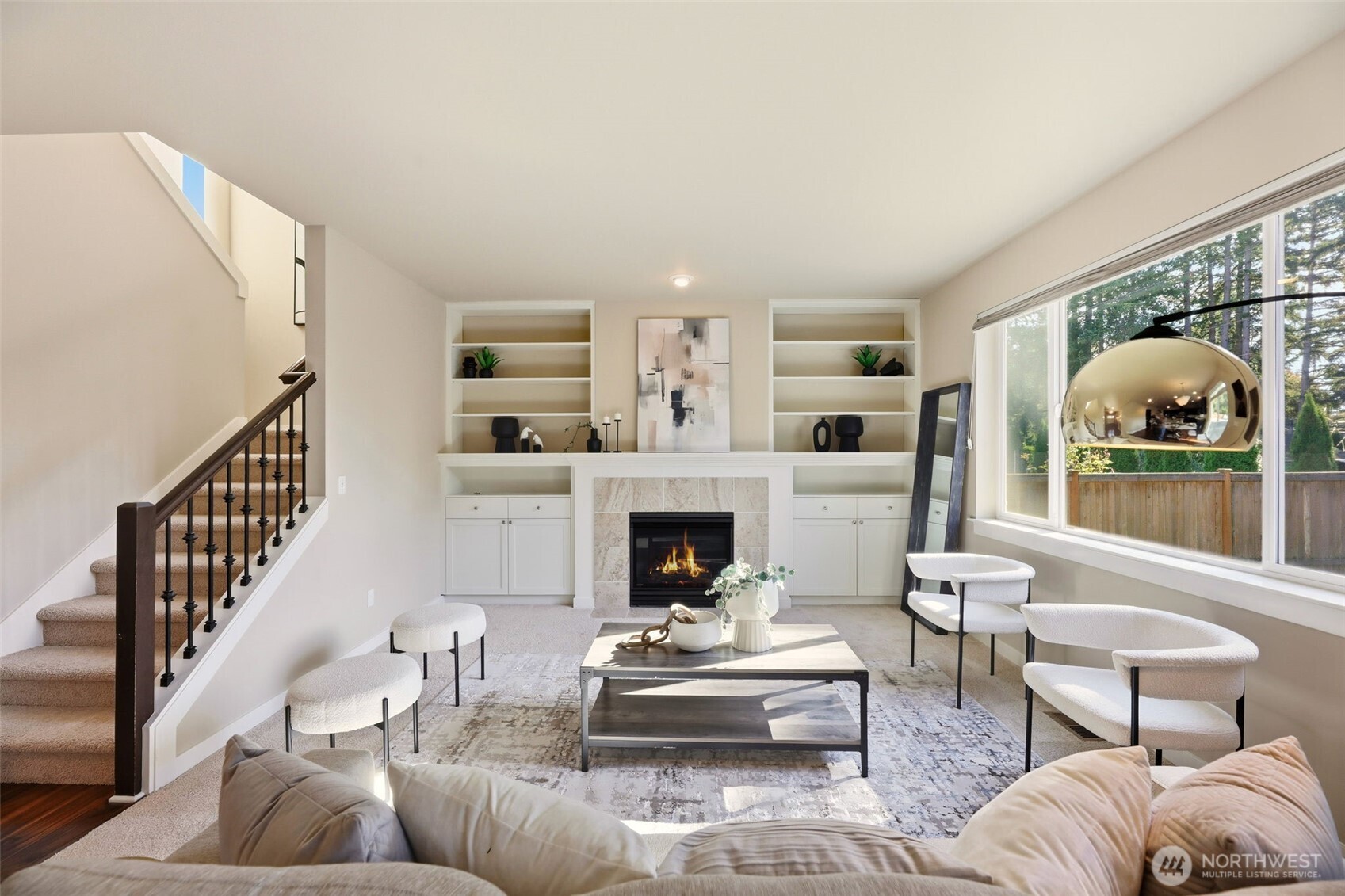 816 218th Street Southeast Bothell, WA 98021 - Photo 7 of 34 a living room with furniture a fireplace and a large window