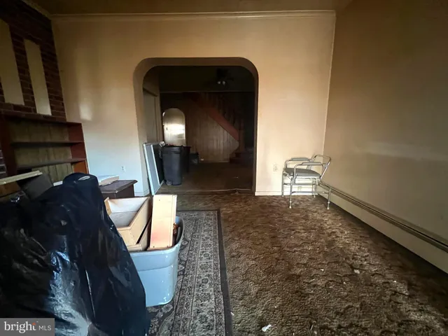 a view of empty room with stairs