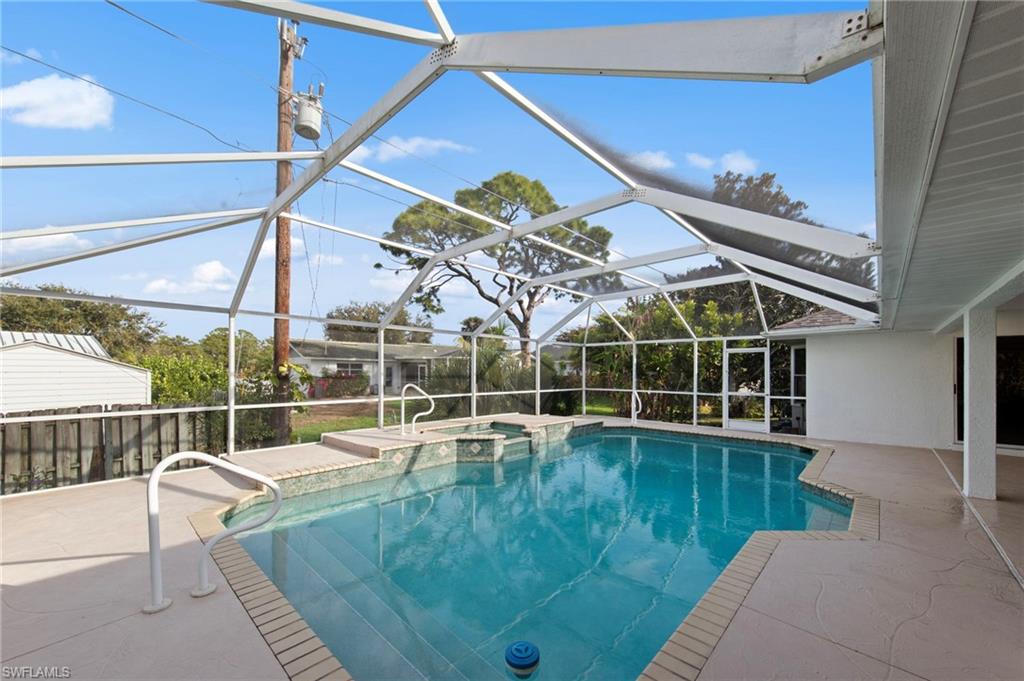 4724 Riverside Drive Estero, FL 33928 - Photo 32 of 44 a view of a house with a swimming pool