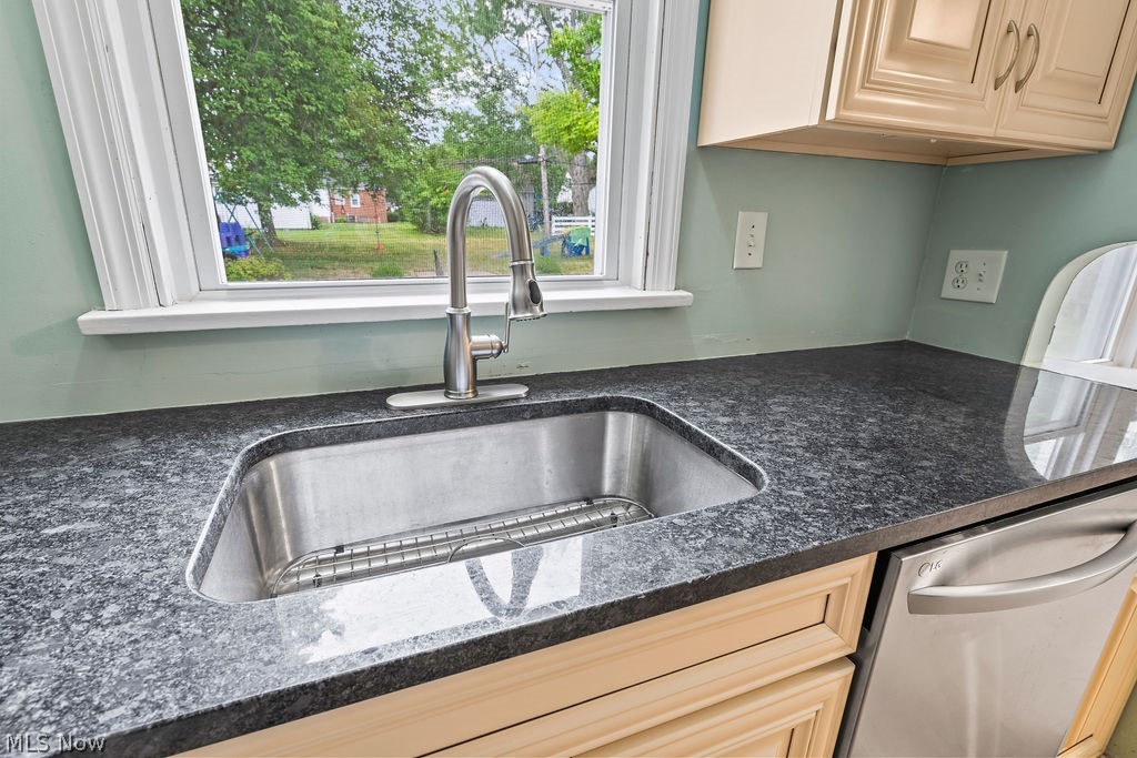 1653 Overbrook Road Cleveland, OH 44124 - Photo 15 of 29 Interior details featuring dishwasher, light brown cabinets, and sink