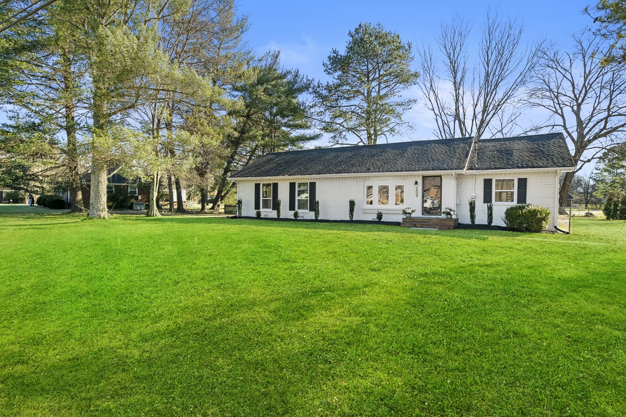 209 Stable Road Franklin, TN 37069 - Photo 1 of 25 a view of house with yard and green space