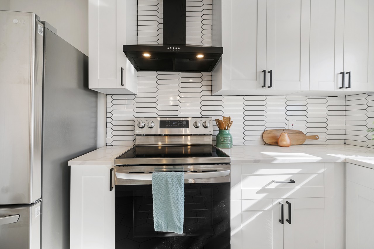 209 Stable Road Franklin, TN 37069 - Photo 12 of 25 a kitchen with a stove and a sink