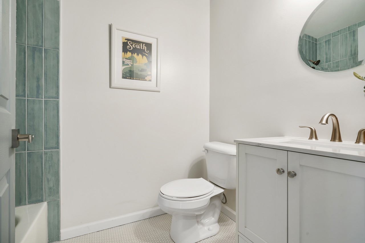 209 Stable Road Franklin, TN 37069 - Photo 13 of 25 a bathroom with a toilet a sink and mirror