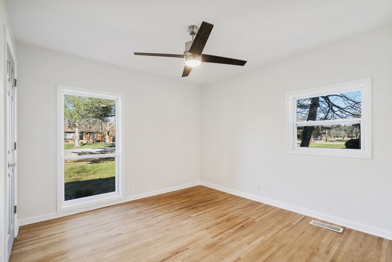 209 Stable Road Franklin, TN 37069 - Photo 20 of 25 a view of empty room with wooden floor and window