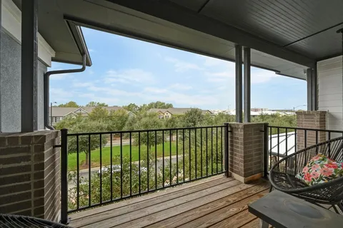 a view of balcony with furniture