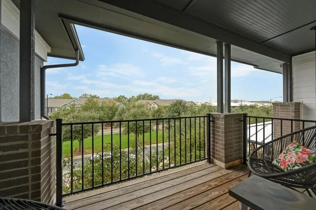 a view of balcony with furniture
