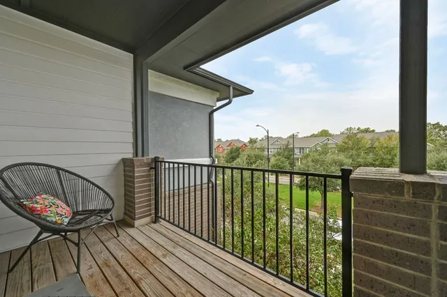 a view of balcony with furniture