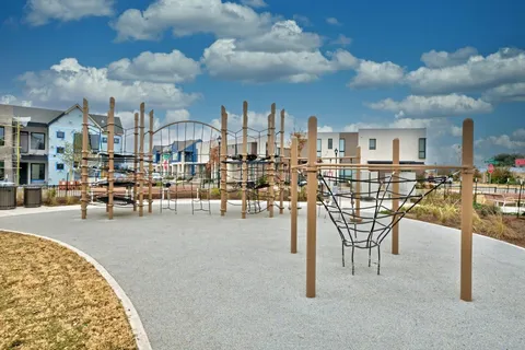 a view of a swimming pool with outdoor seating