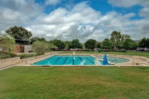 a view of a swimming pool with an outdoor space