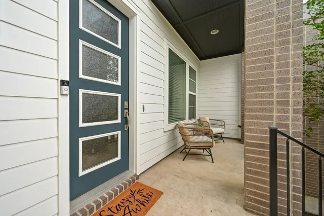 a patio with table and chairs