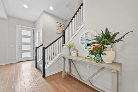 a view of entryway with wooden floor and a potted plant