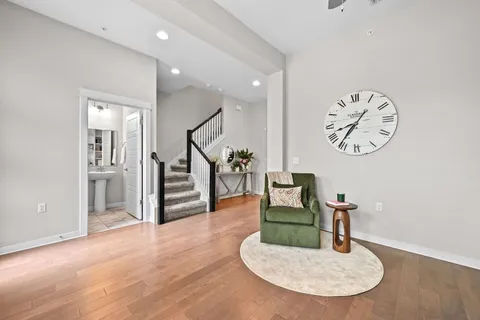a view of a livingroom with furniture and a kitchen