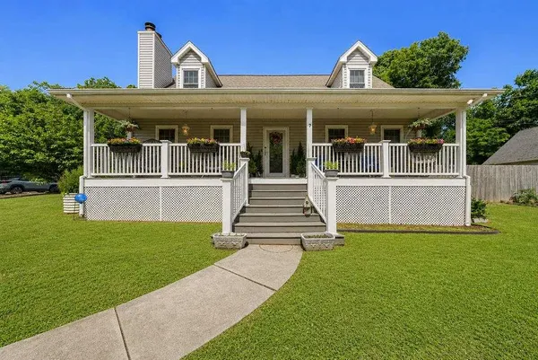 front view of a house with a yard