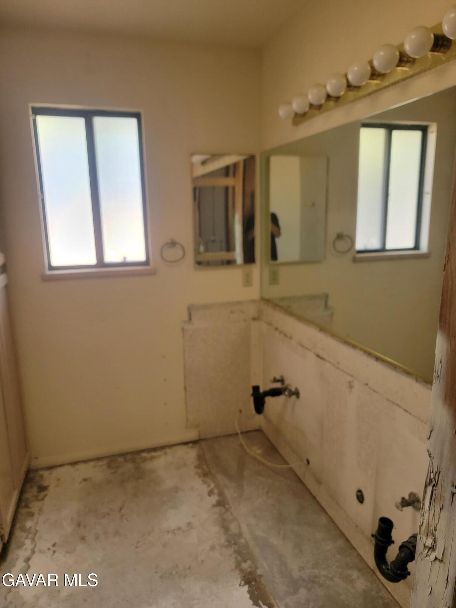 21481 Randsburg Mojave Road California City, CA 93505 - Photo 27 of 28 a bathroom with a sink and a mirror