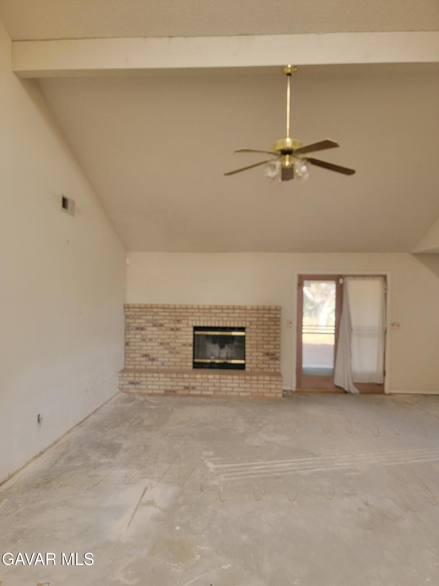 21481 Randsburg Mojave Road California City, CA 93505 - Photo 8 of 28 a view of a livingroom with a ceiling fan and window