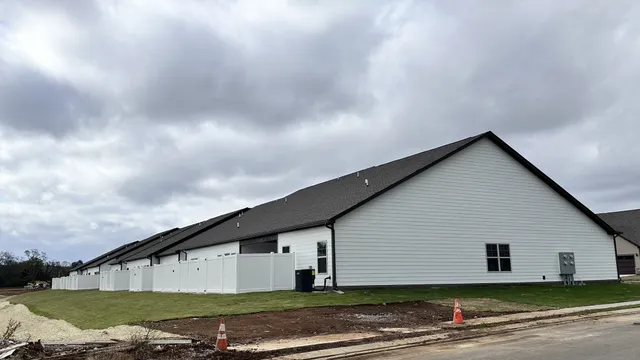 a view of a house with backyard