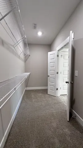 a view of an empty walk in closet