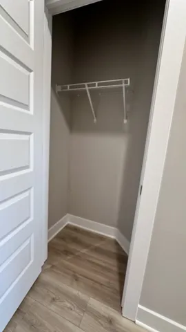 a kitchen with stainless steel appliances granite countertop a refrigerator a stove a microwave and a sink