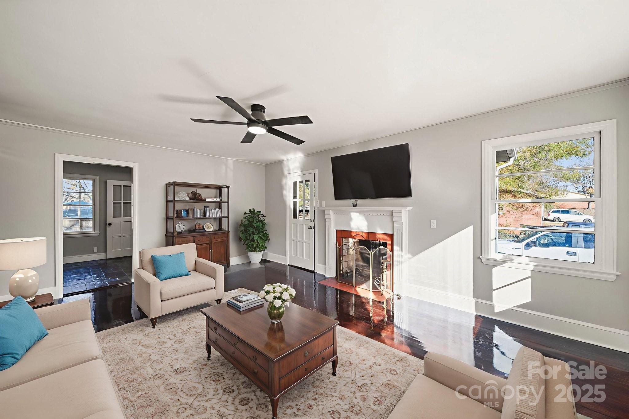 1204 Elmore Street Gaffney, SC 29340 - Photo 2 of 30 a living room with furniture a flat screen tv and a window