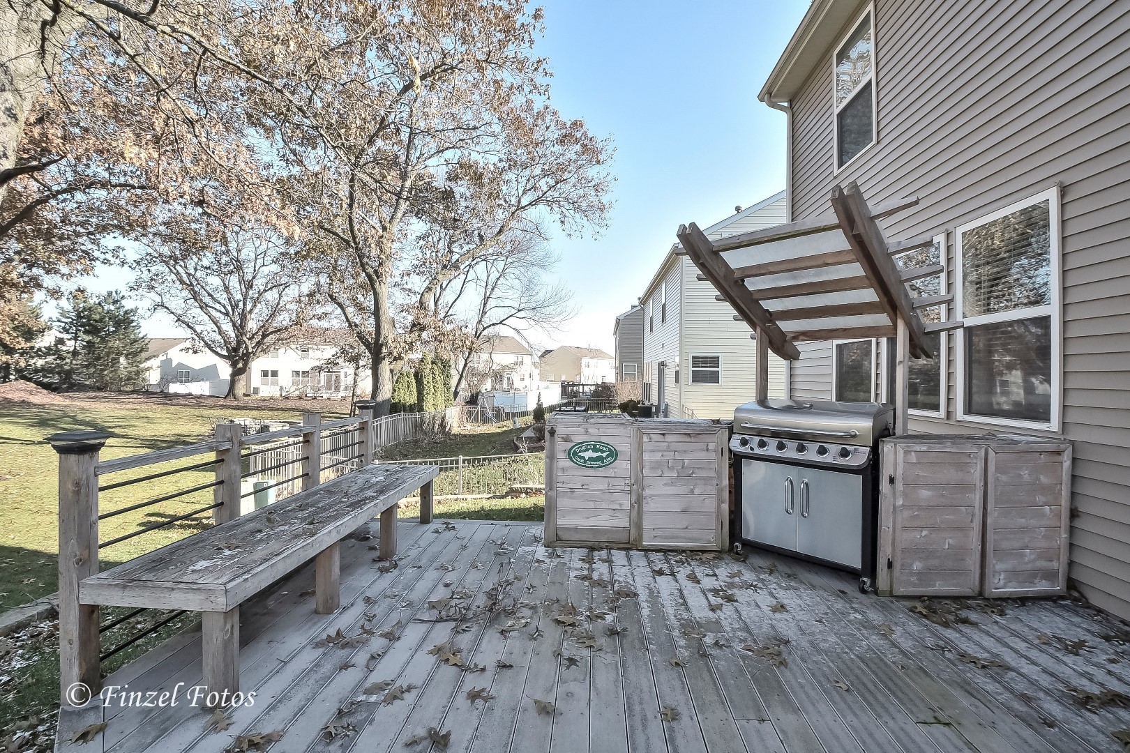 1912 Roger Road Woodstock, IL 60098 - Photo 2 of 21 a view of a chairs and table on the wooden deck