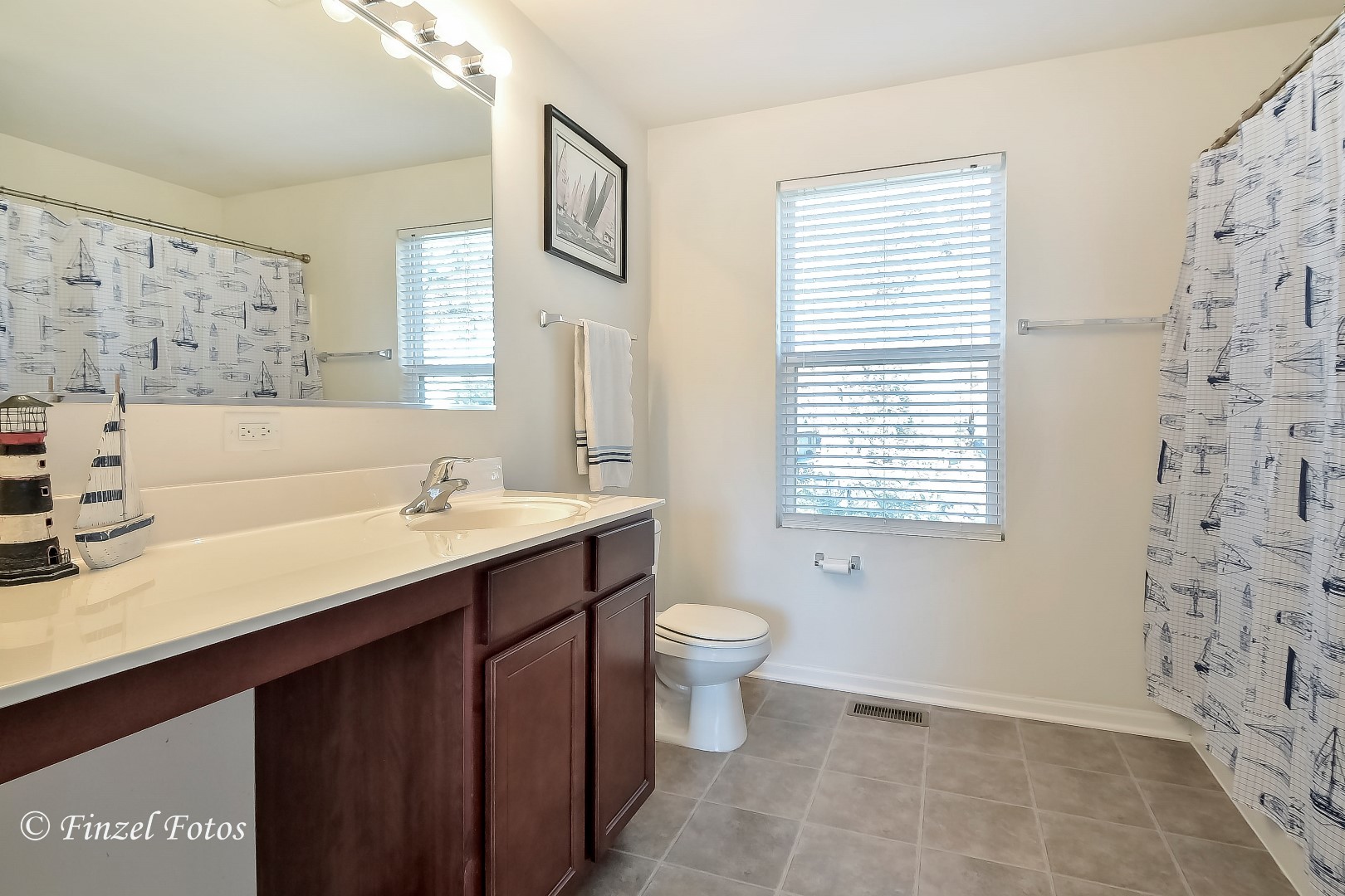 1912 Roger Road Woodstock, IL 60098 - Photo 11 of 21 a bathroom with a sink toilet and shower