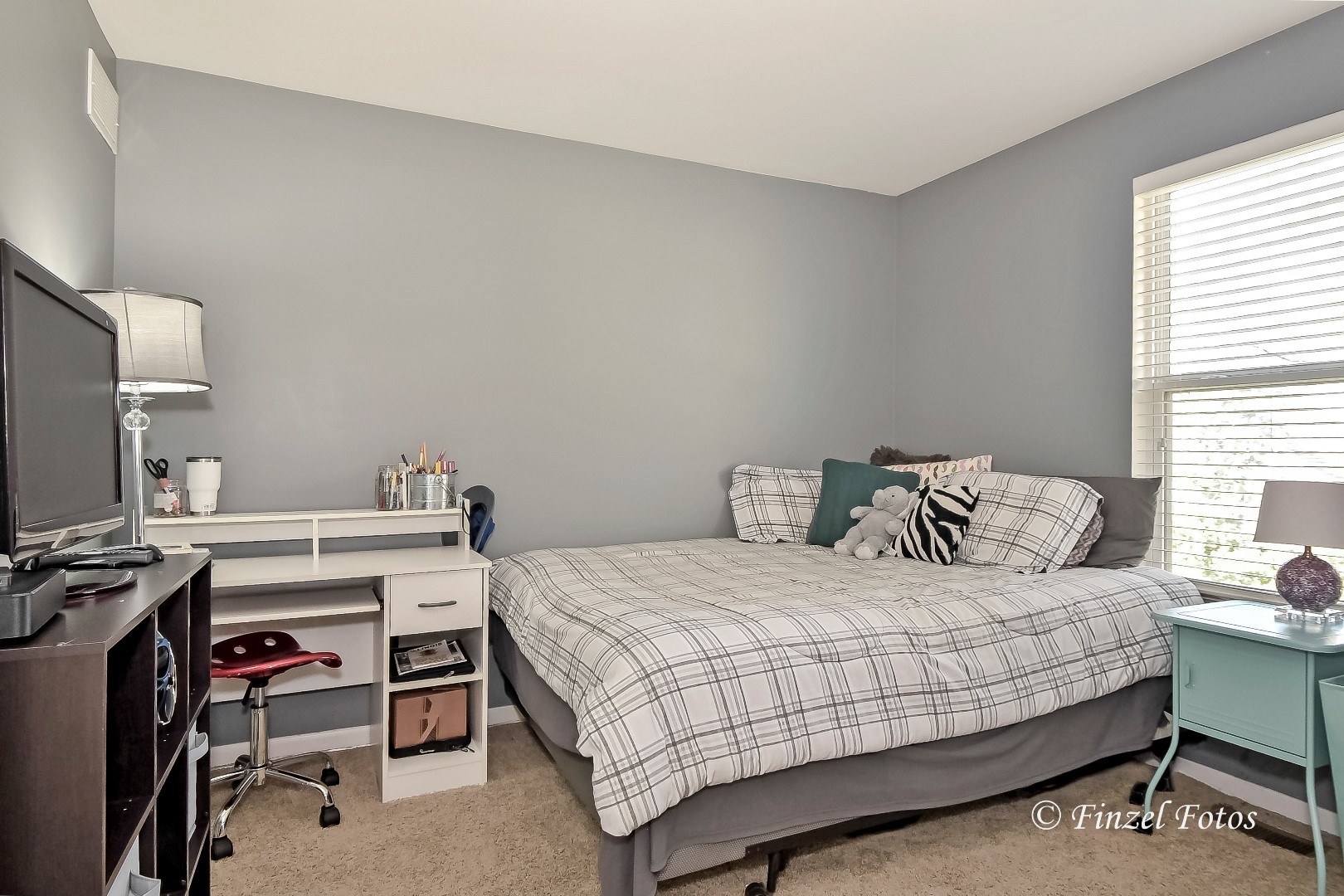 1912 Roger Road Woodstock, IL 60098 - Photo 12 of 21 a bedroom with a bed and a desk