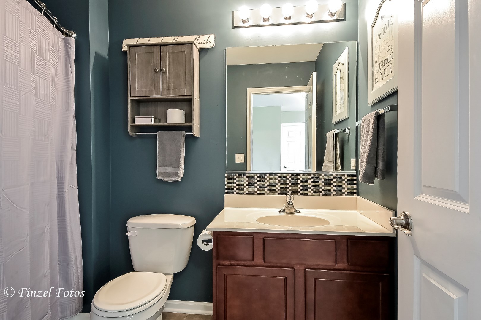 1912 Roger Road Woodstock, IL 60098 - Photo 15 of 21 a bathroom with a sink and a toilet