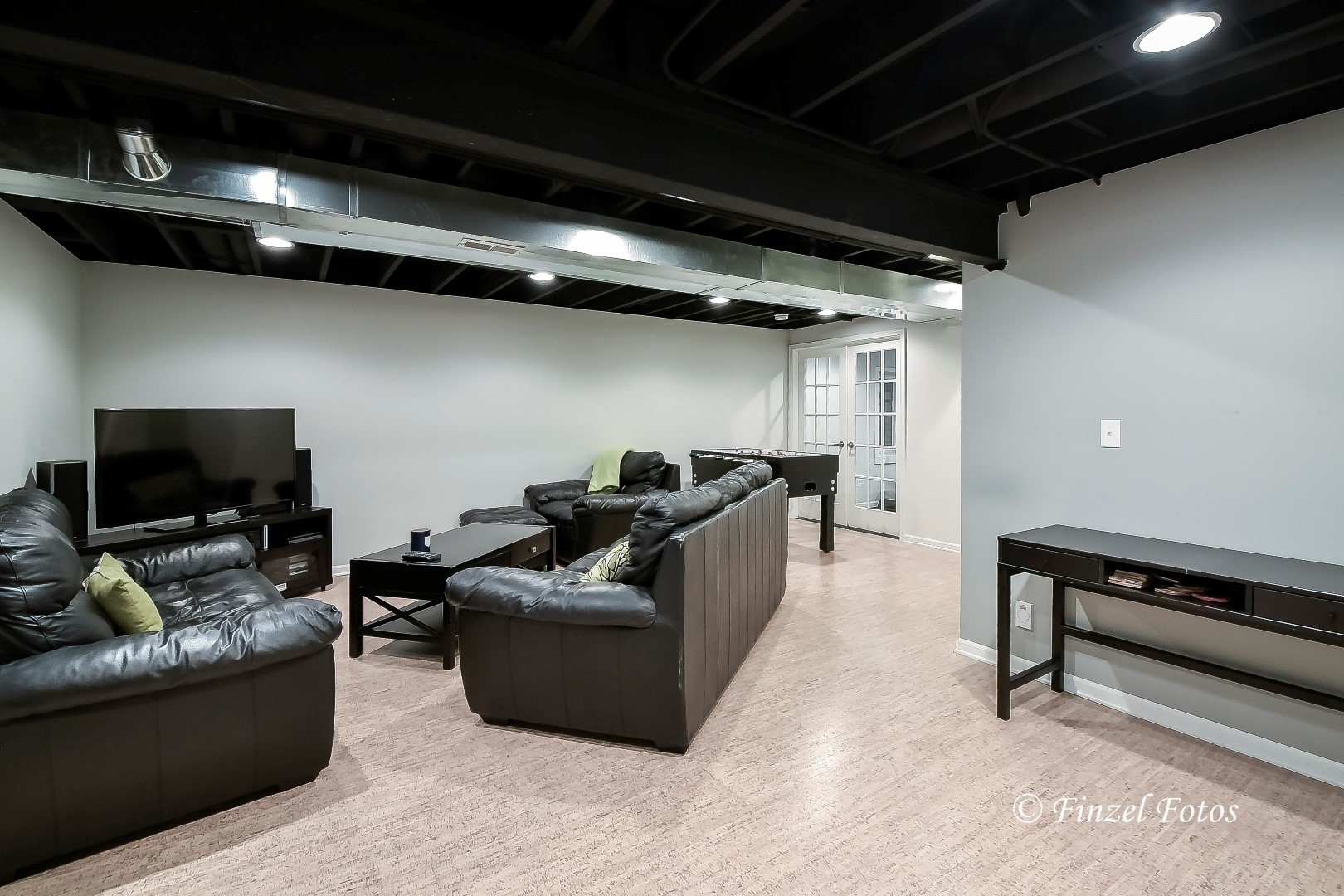 1912 Roger Road Woodstock, IL 60098 - Photo 17 of 21 a living room with furniture and a flat screen tv