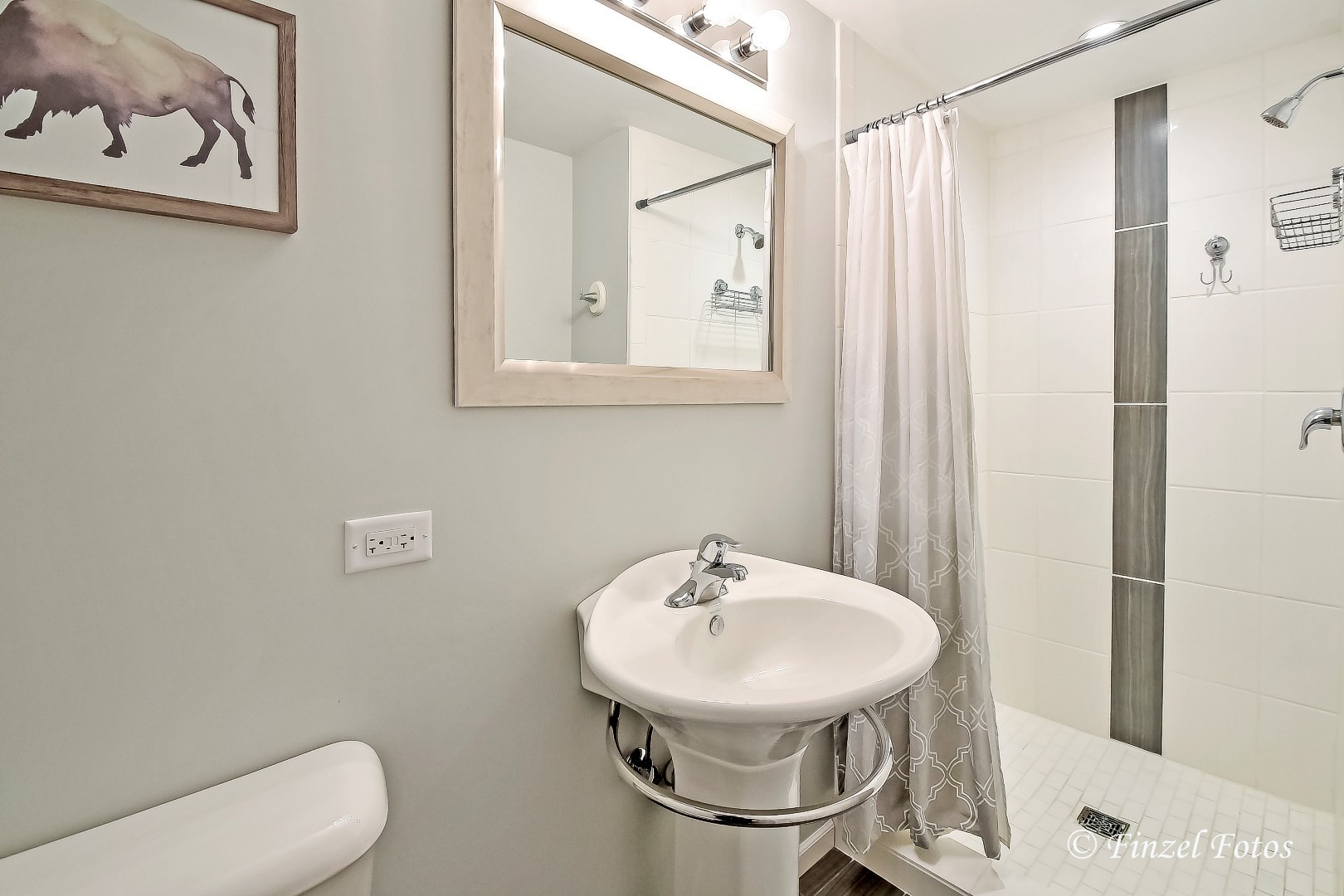 1912 Roger Road Woodstock, IL 60098 - Photo 19 of 21 a bathroom with a sink a toilet and shower