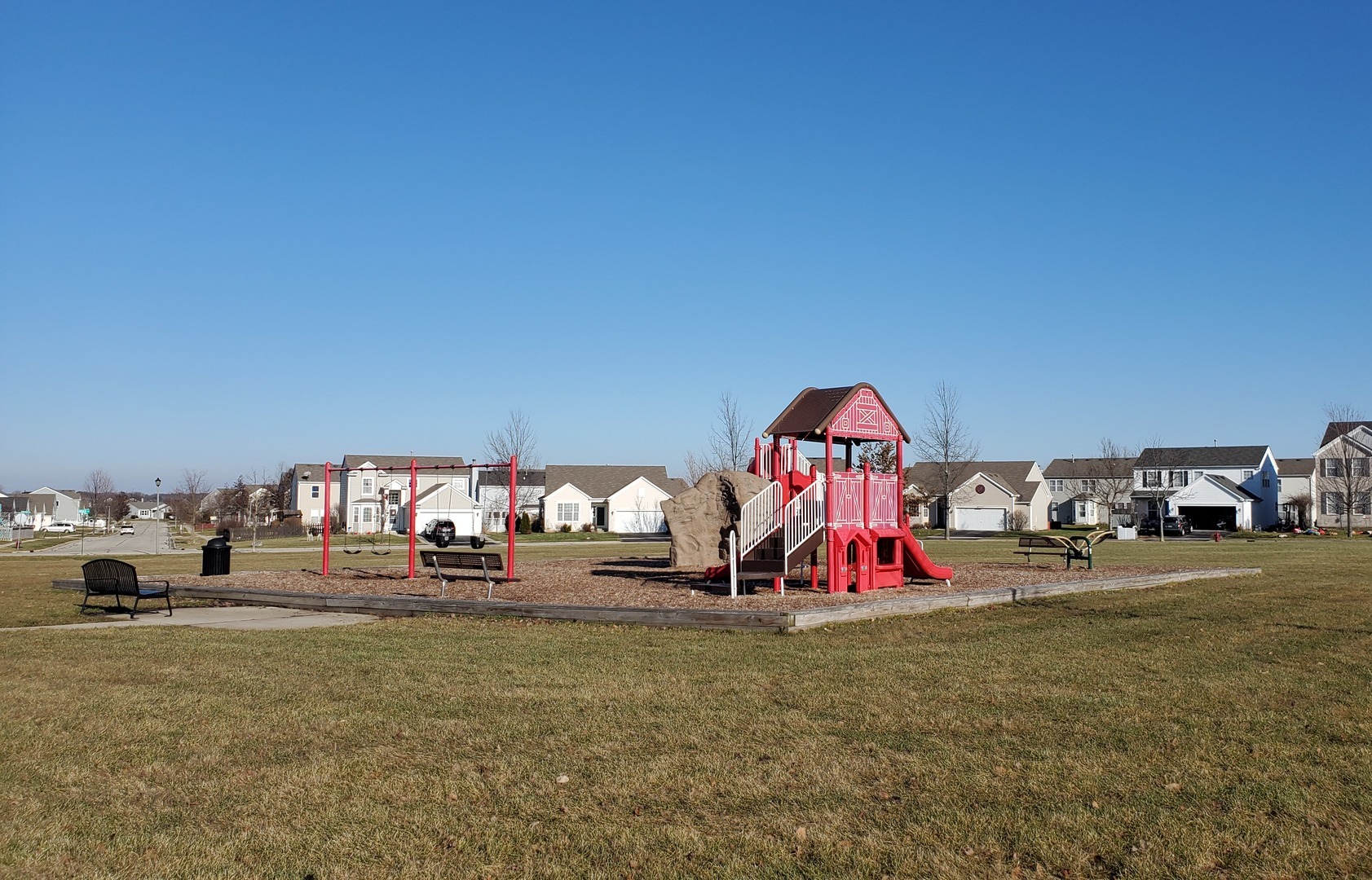 1912 Roger Road Woodstock, IL 60098 - Photo 21 of 21 a view of play ground with a table and chairs