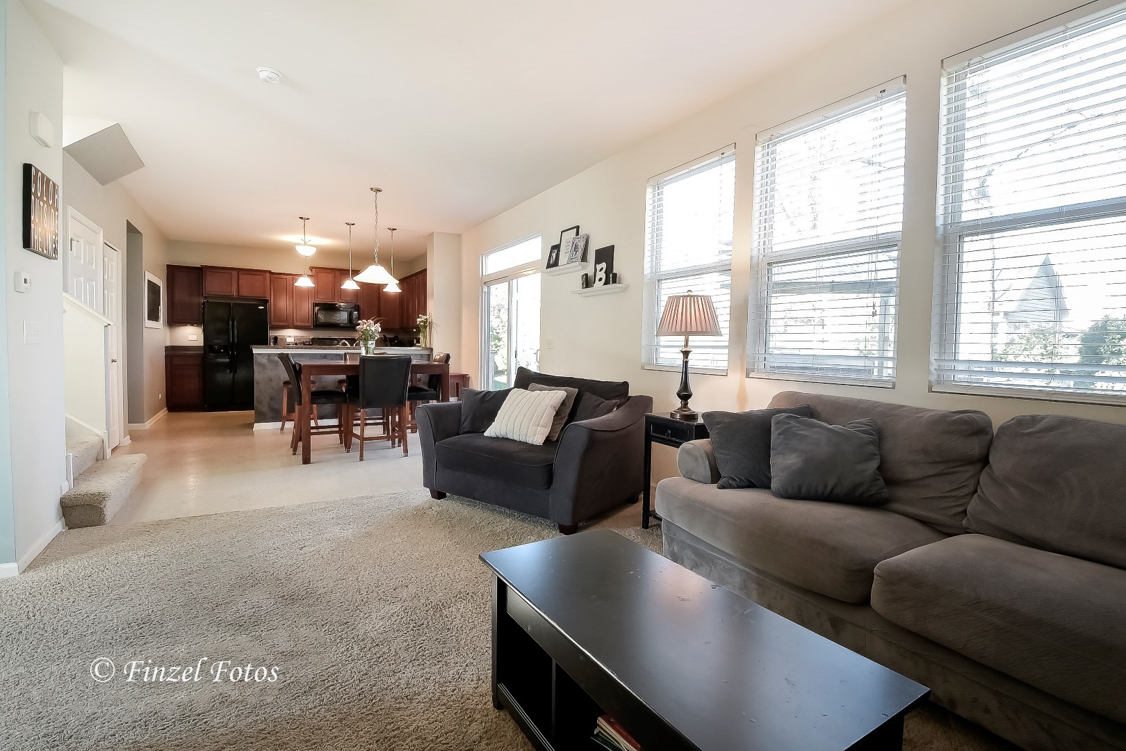 1912 Roger Road Woodstock, IL 60098 - Photo 6 of 21 a living room with furniture and a large window