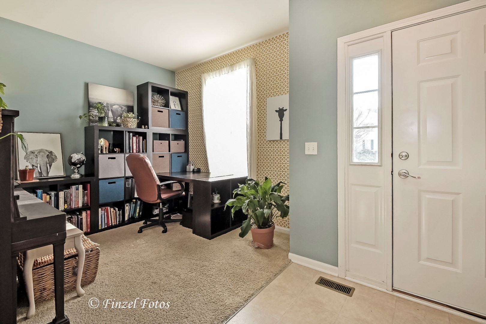 1912 Roger Road Woodstock, IL 60098 - Photo 7 of 21 a view of a workspace with furniture and a window