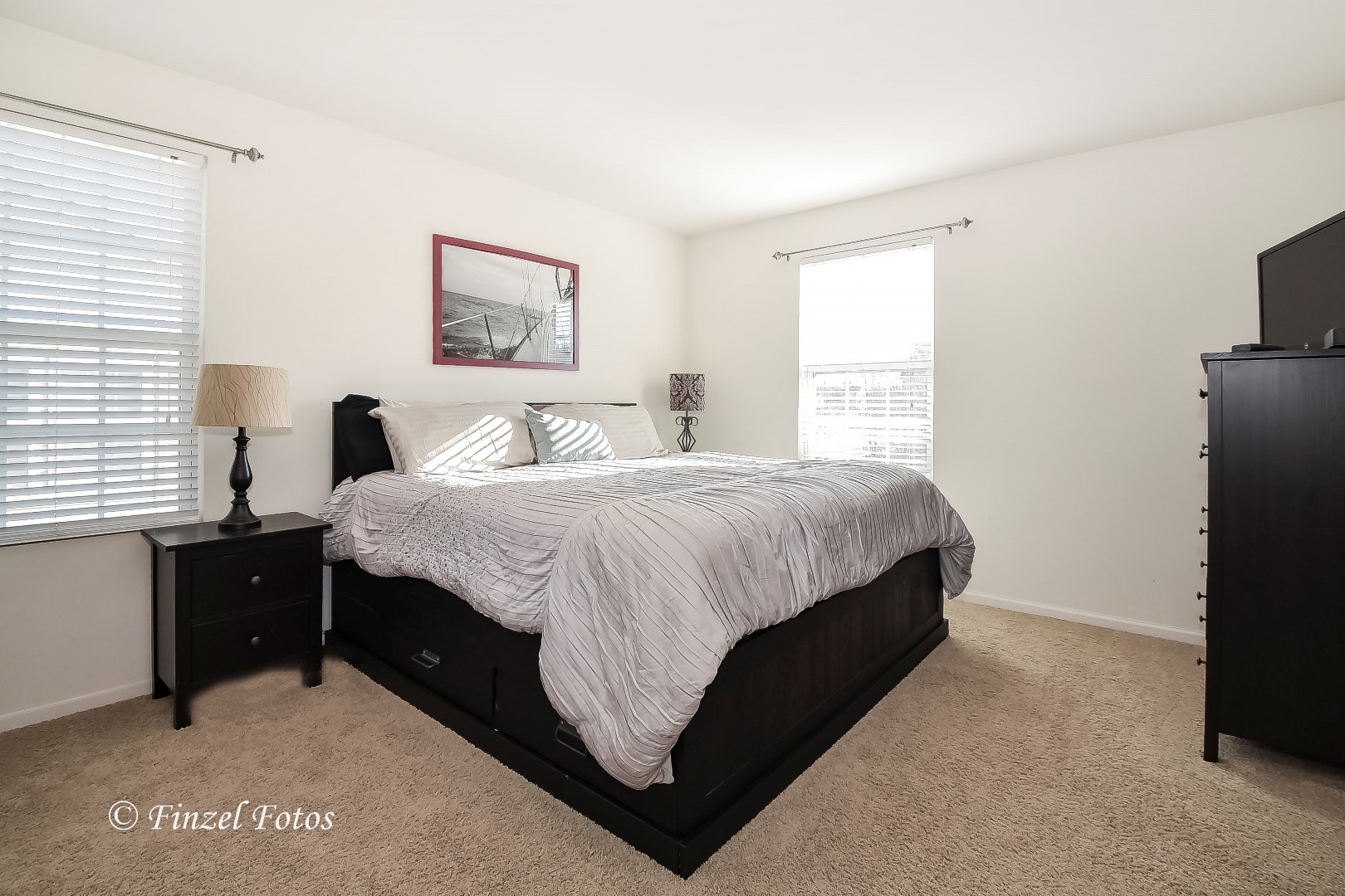 1912 Roger Road Woodstock, IL 60098 - Photo 10 of 21 a bedroom with a bed and a tv on the dresser
