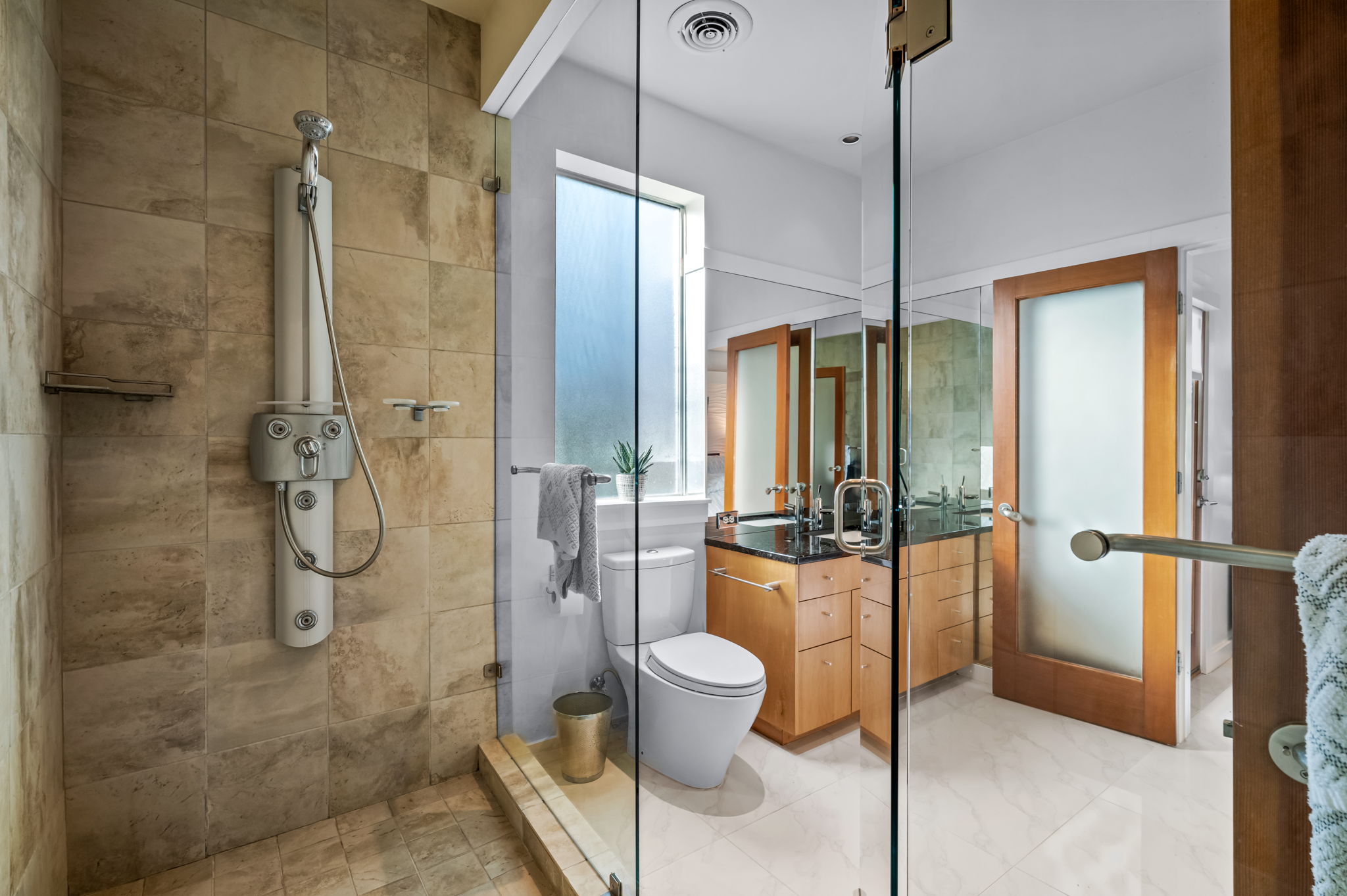 1700 Ravey Street, Unit A Austin, TX 78704 - Photo 29 of 40 Bathroom with vanity and a tile shower