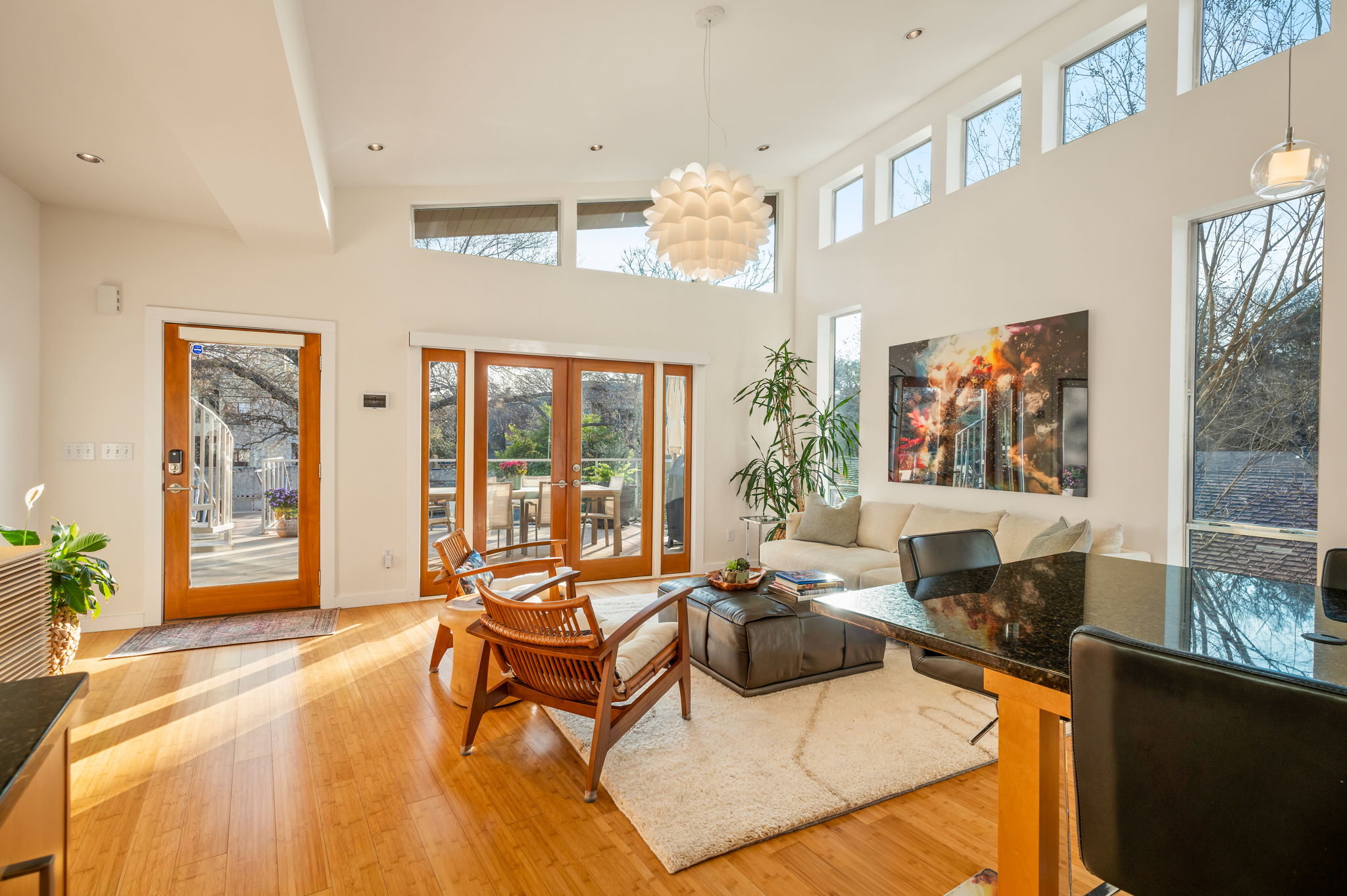 1700 Ravey Street, Unit A Austin, TX 78704 - Photo 9 of 40 Living room featuring light wood-type flooring, french doors, recessed lighting, and a high ceiling