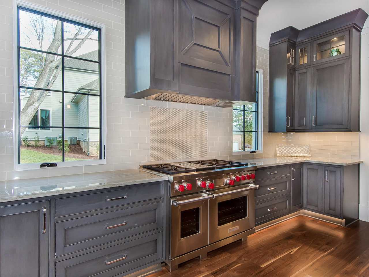 3210 Cobblestone Court Raleigh, NC 27607 - Photo 10 of 23 Plenty of Space and all the Details with Soft Close Drawers, Display Cabinets for your treasures, Amazing Hood and Back splash.