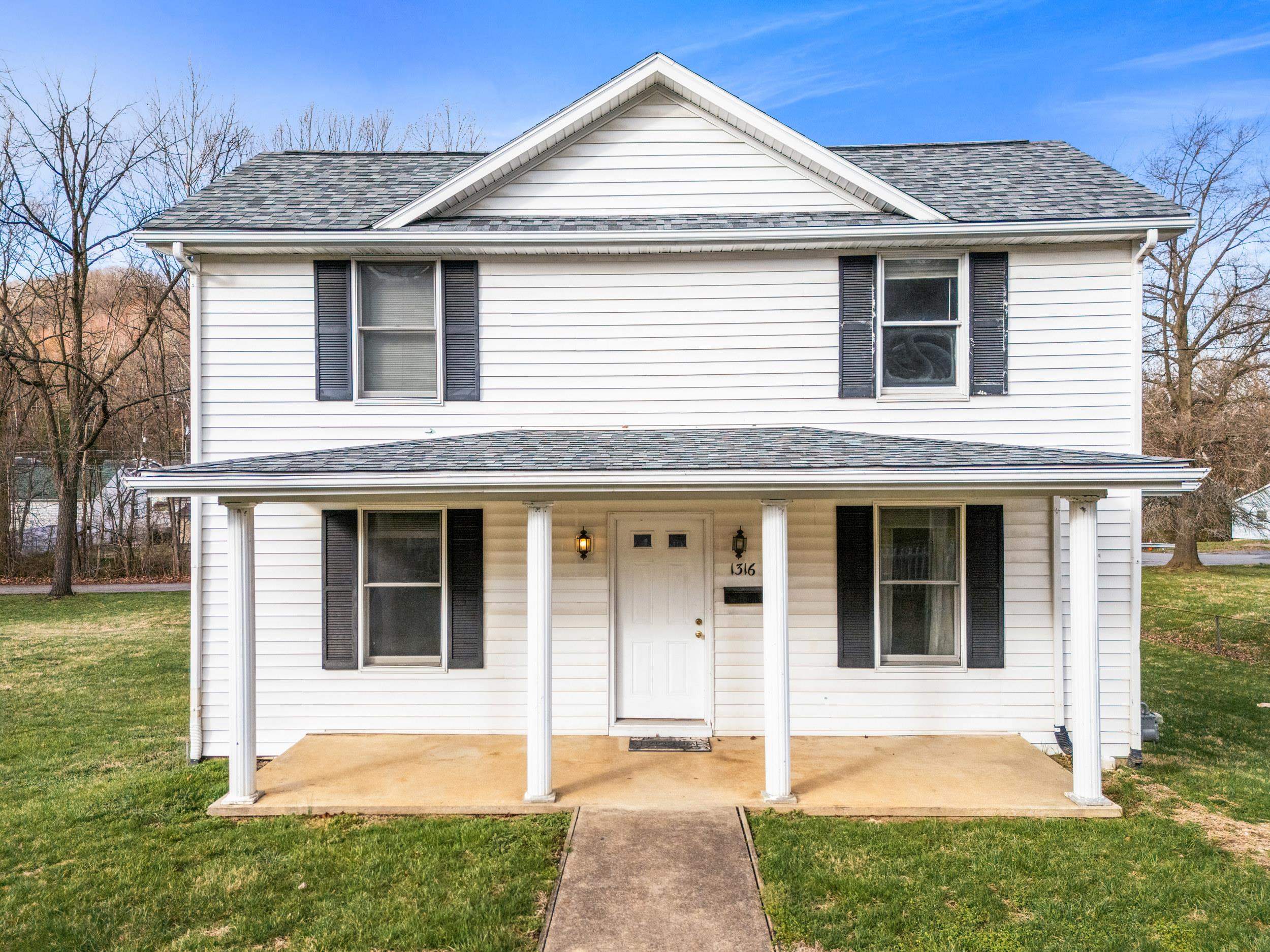 1316 East Main Street Waynesboro, VA 22980 - Photo 1 of 34 a front view of a house with a yard