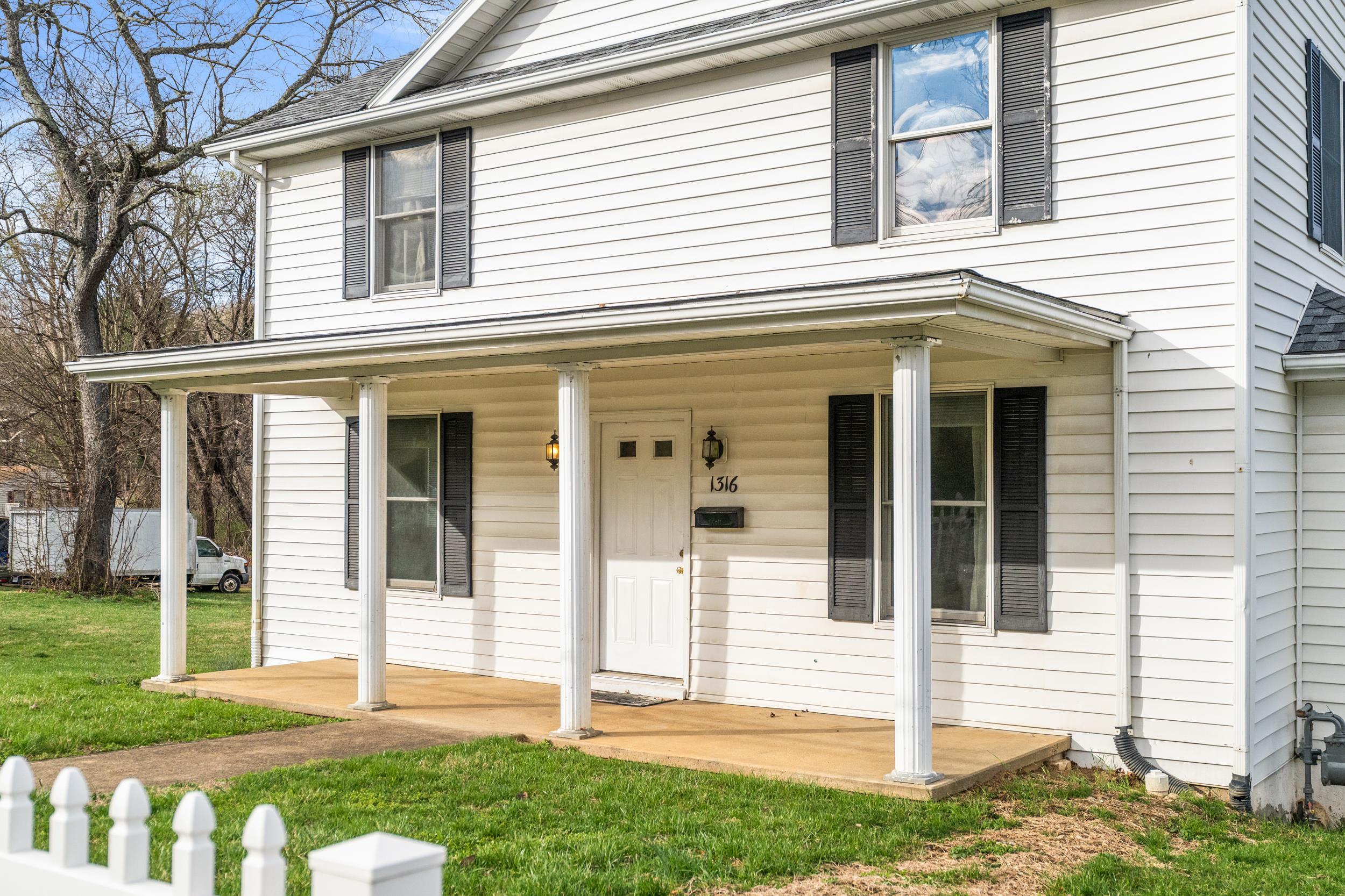 1316 East Main Street Waynesboro, VA 22980 - Photo 11 of 34 a front view of a house with a yard
