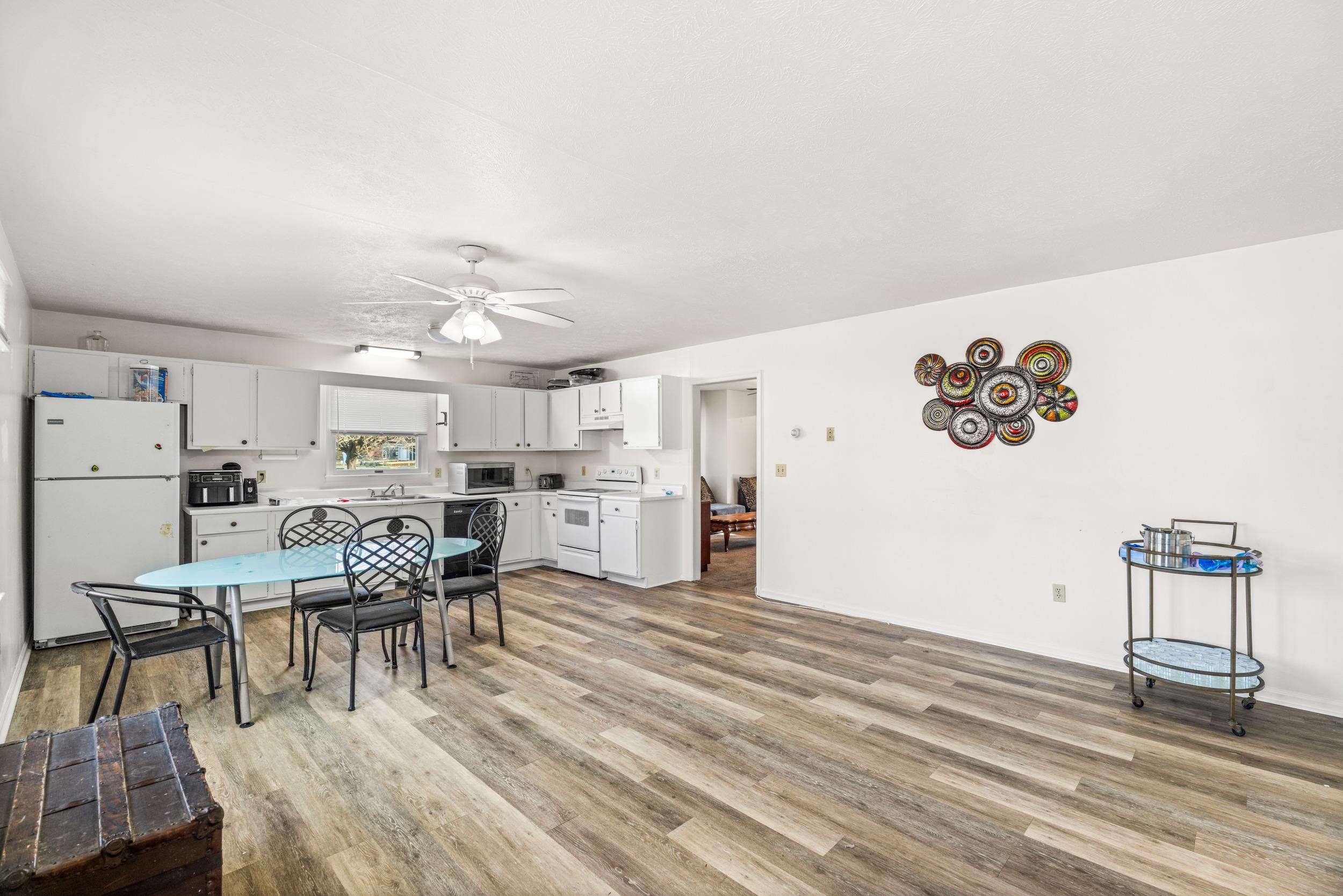 1316 East Main Street Waynesboro, VA 22980 - Photo 12 of 34 a view of a dining room with furniture and wooden floor